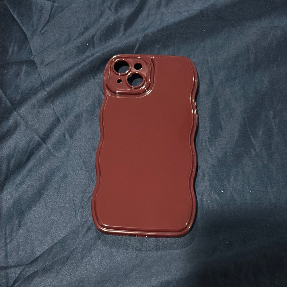 Iphone 15 plus wavy burgundy case. Used once!